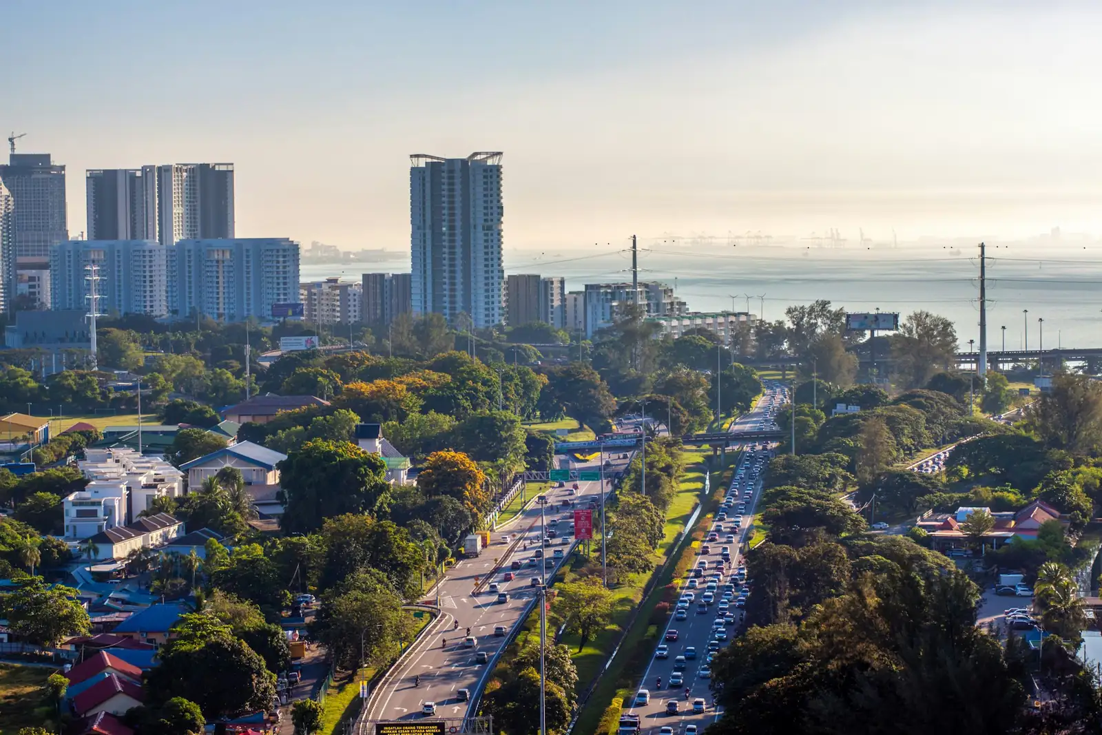 Penang skyline with a coastal highway and the sea at sunrise